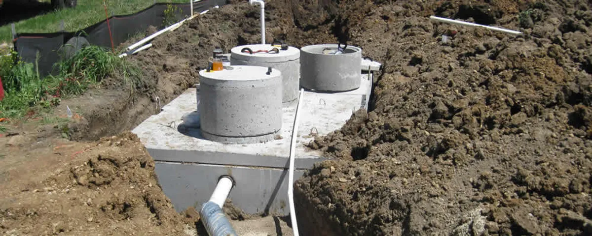 Septic system repair and installation site with tank access ports in Wilmington, NC